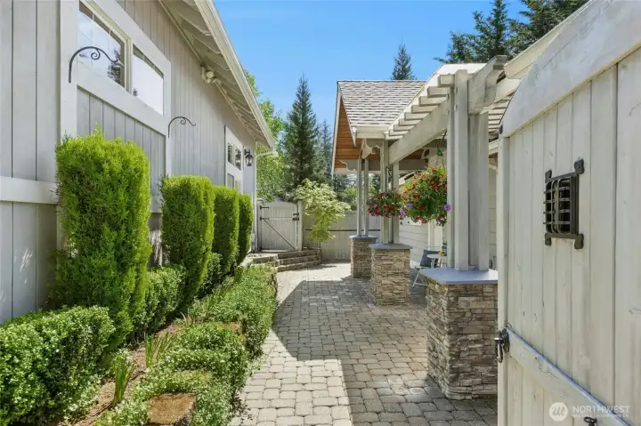 Secluded entry to patio space. House access and shop access.