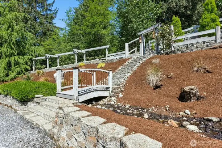 Head up the beautiful grounds to the upper level 2-car detached garage.