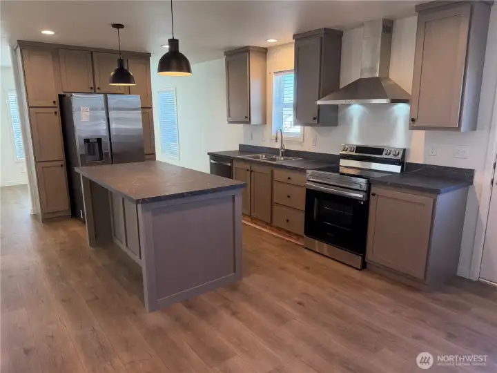 Kitchen w/SS appliances and a pantry.