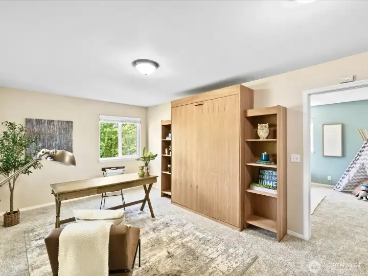 Room shown as office, note Murphy Bed!