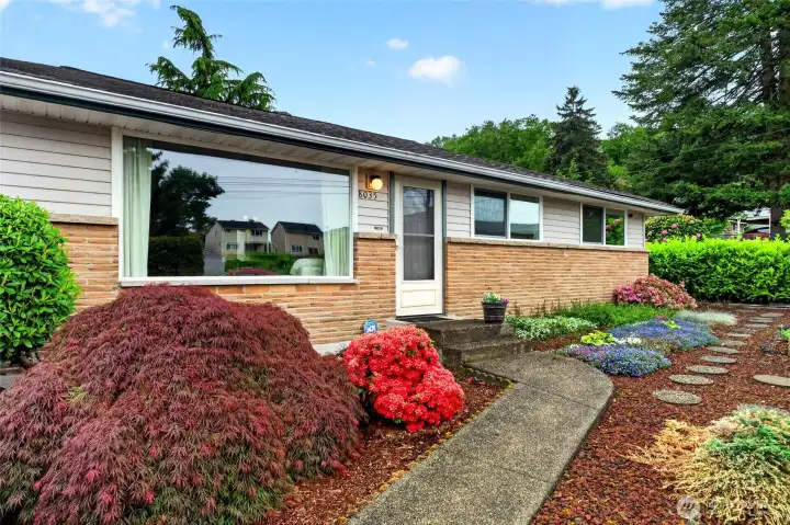 Amazing single-story rambler with inviting curb appeal and a beautifully maintained yard that creates a warm welcome from the moment you arrive. Thoughtfully designed garden beds, manicured shrubs, and a curved pathway add character while reflecting the exceptional care and pride of ownership throughout the property.