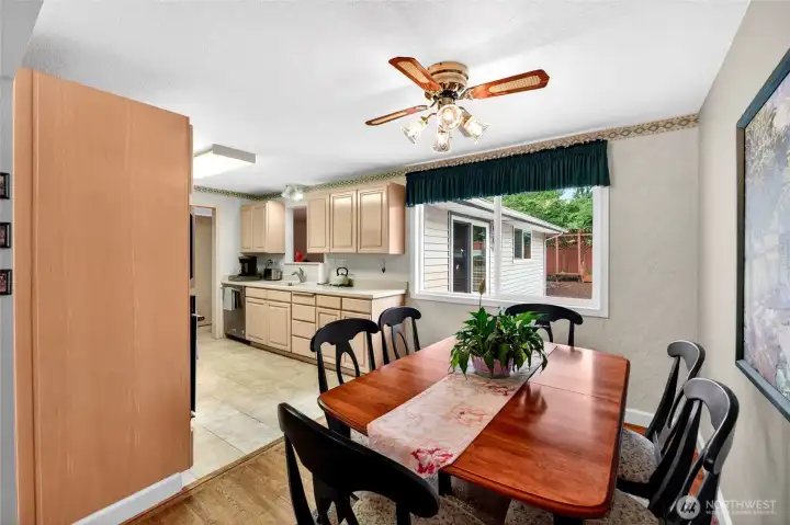 Dining space flows seamlessly into the kitchen and offers easy access to outdoor entertaining and backyard views.