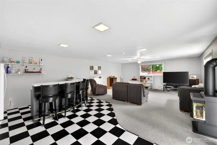 Open entertainment area with room for oversized seating, casual gatherings, and seamless access to the outdoor patio.