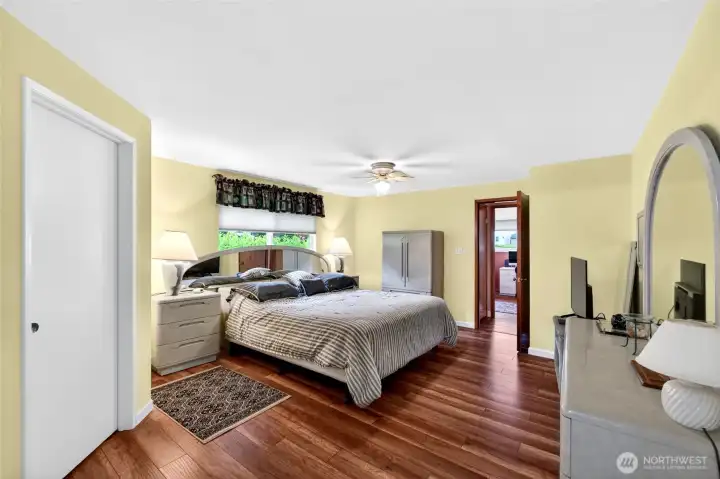 Spacious primary bedroom offers plenty of room for oversized furnishings while maintaining a bright and comfortable atmosphere. Nice large walk in closet.