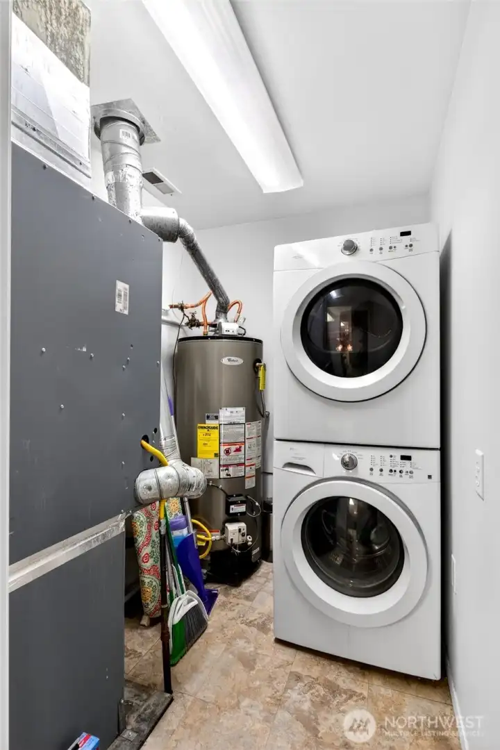 Dedicated laundry and utility room provides convenient in-home washer and dryer setup.