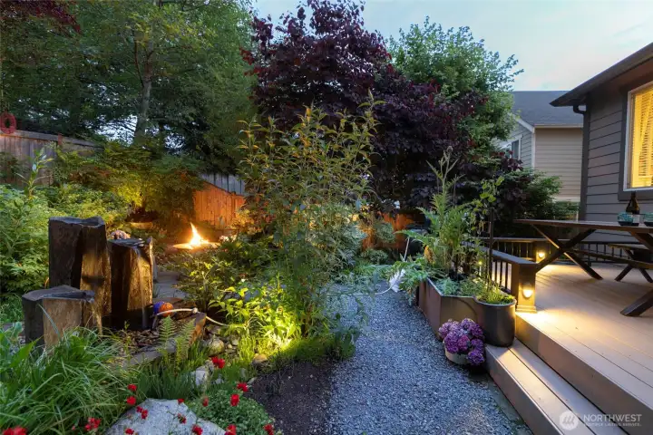 Basalt fountain and beautiful landscaping lights. This fully fenced private yard is mature and easy care with irrigation in place.
