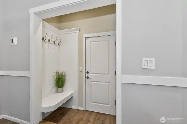 Handy nook space next to the garage for coats, shoes, backpacks, etc.