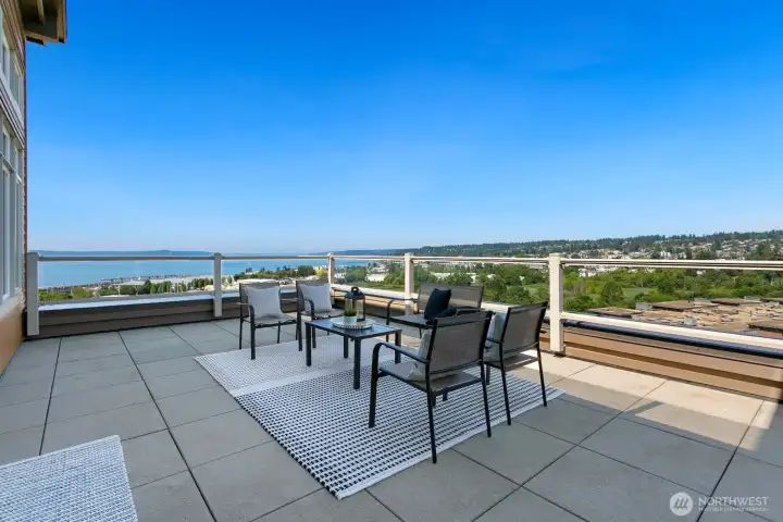 Expansive corner deck with sweeping views of Puget Sound, the Edmonds Bowl, marina, and ferry.