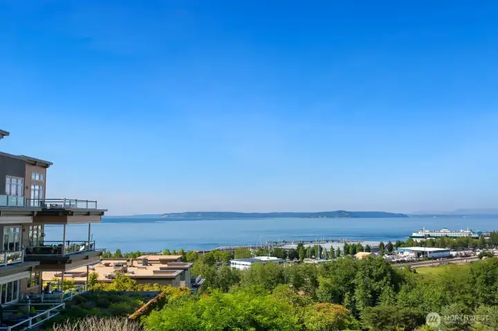 Unit #309 Top-corner residence shown at left, positioned high above the Edmonds waterfront with unobstructed views of Puget Sound, the marina, and ferry.