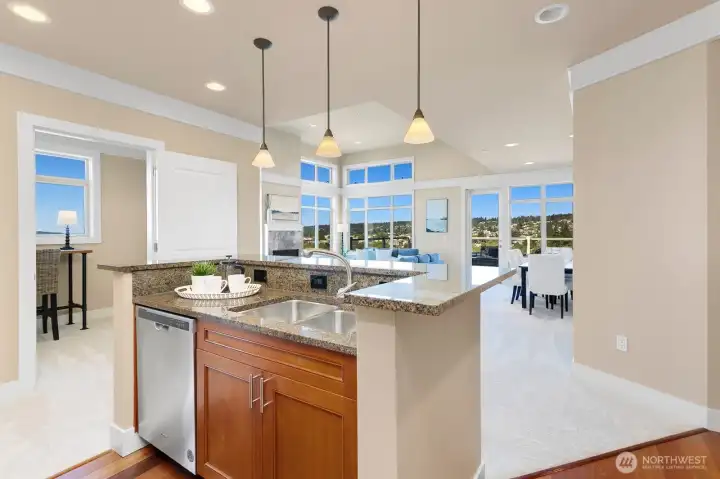 Open kitchen connected to the main living spaces and view backdrop.