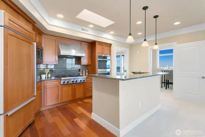 Open kitchen layout with island seating and easy connection to the living areas.