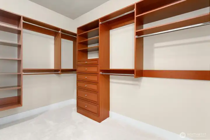 Large primary walk-in closet with custom built-ins