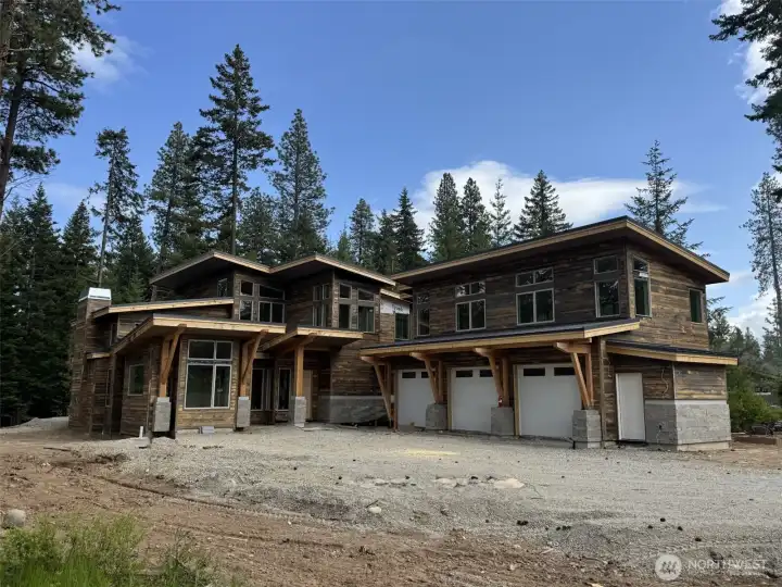 Image is of a Suncadia home being built, similar siding and stone for reference.