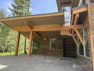 Image is of a Suncadia home being built, similar siding and stone for reference.