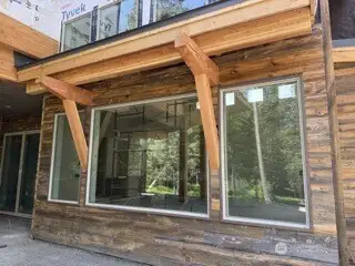Image is of a Suncadia home being built, similar siding and stone for reference.