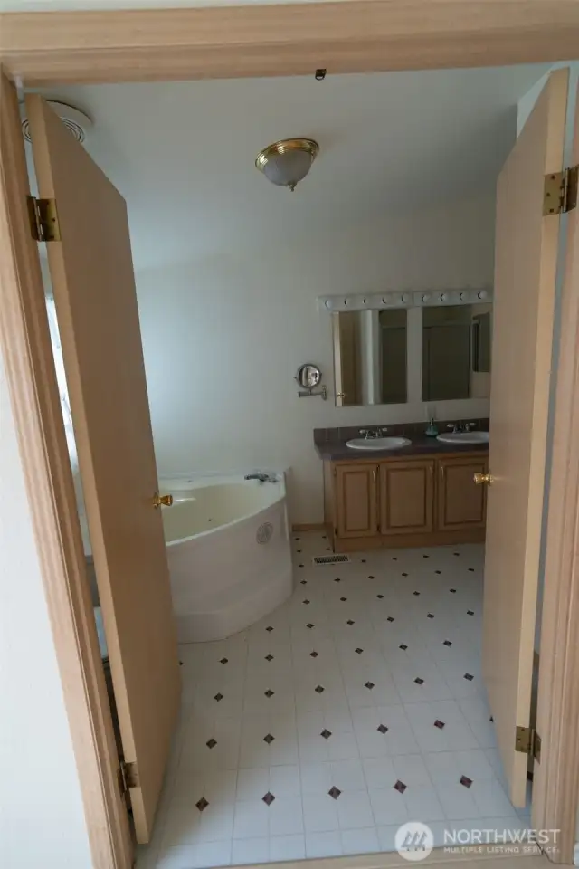 French doors into the primary bathroom.