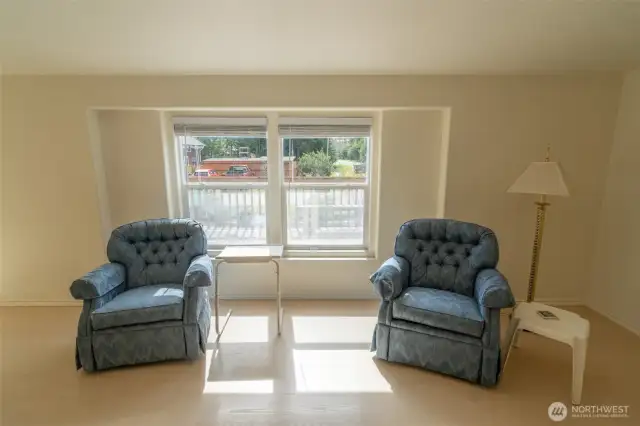 Just inside the front door, on the left.