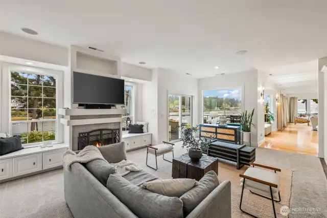 The family room off the kitchen offer a place to curl up and enjoy the fireplace and company