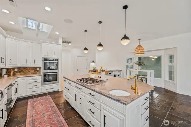 The kitchen allows for space for all and views onto the indoor pool