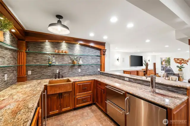 The bar is complete with a built-in tap/kegerator, dishwasher, ice machine, wine fridge & refrigerator...not to mention a 300-bottle wine room