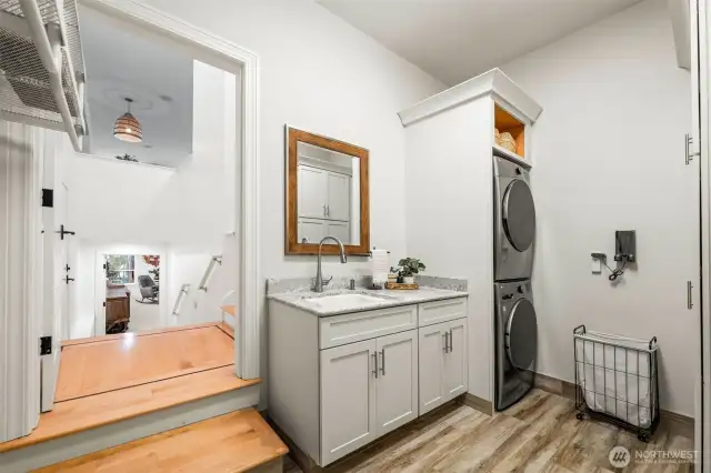 The laundry is conveniently located between the garage, the pool, and the kitchen