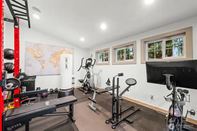 The workout room is perfectly located adjacent to the pool and bathroom