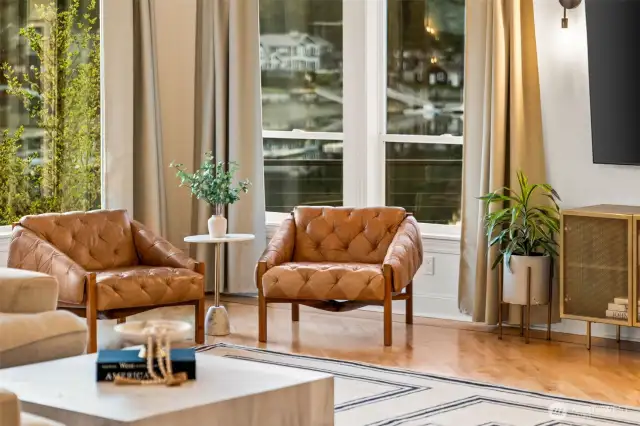 With expansive windows flooding the spaces with natural light and water views