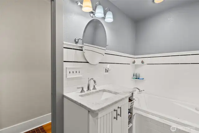 Main bath, mostly tile, jetted tub.