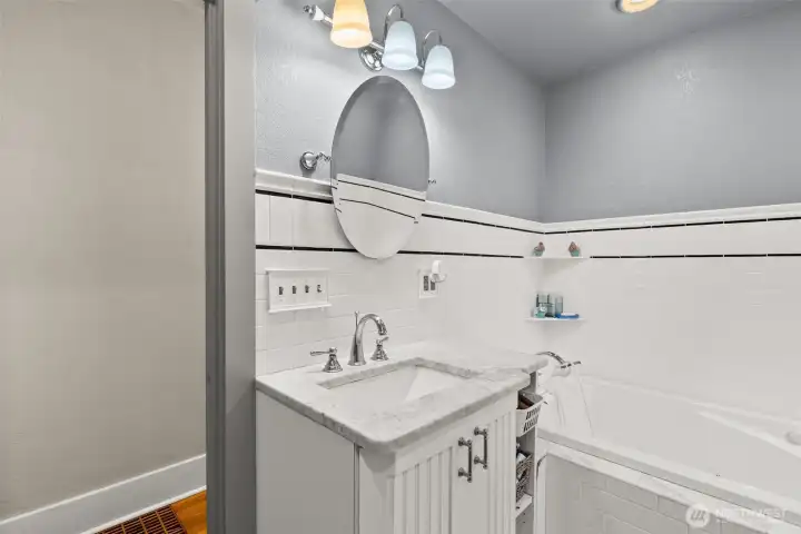 Main bath, mostly tile, jetted tub.