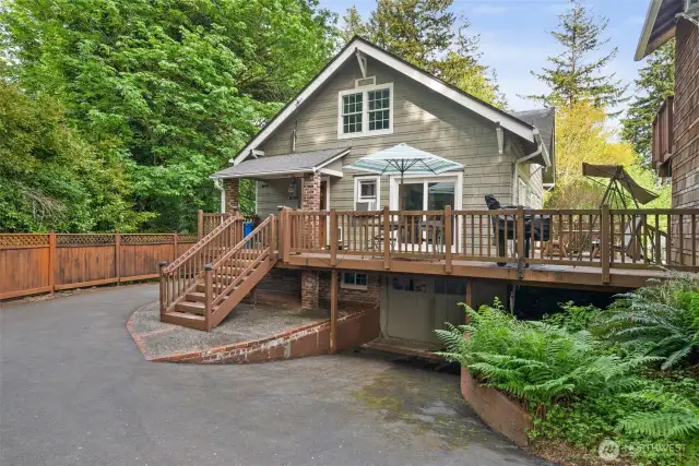 Back of the house with large deck to enjoy.  Lower level used to be the garage.  ADU to the right.
