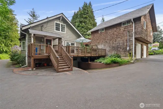 In the circular drive.  The back of the house and the detached ADU above the over-sized 2-car garage.