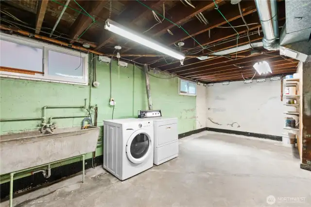 Large unfinished basement with high ceiling, lots of storage and tons of potential!