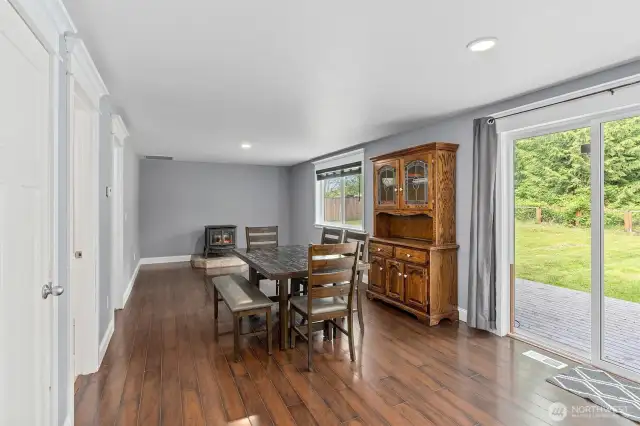 Dining and Family Rooms with Access to Half Bath and Laundry Room