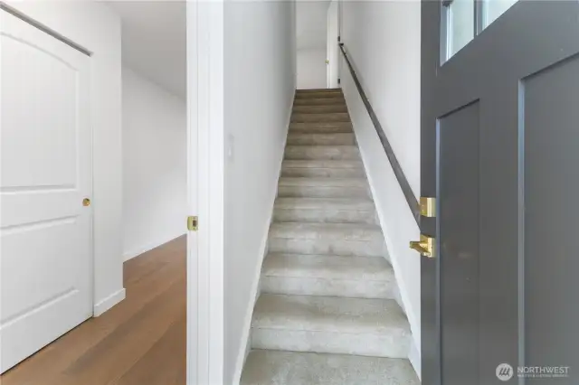 Coming from the second entrance, to the part with a bedroom on this level, and going up to the kitchen and living area.