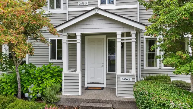 Covered front porch welcomes you home.