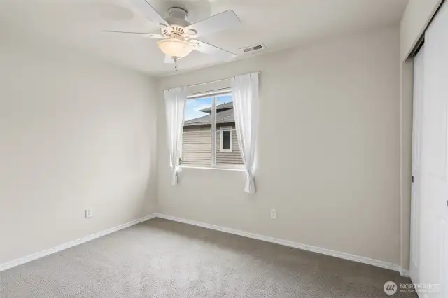 One of two guest bedrooms, both located on the upper level.