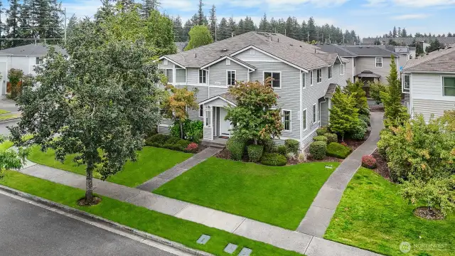 Lush landscaping is taken care of by the HOA.