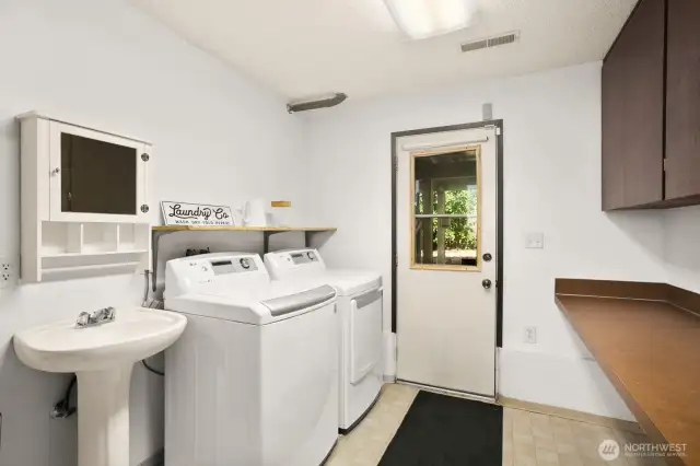 Half bath and laundry room lead to separate entrance