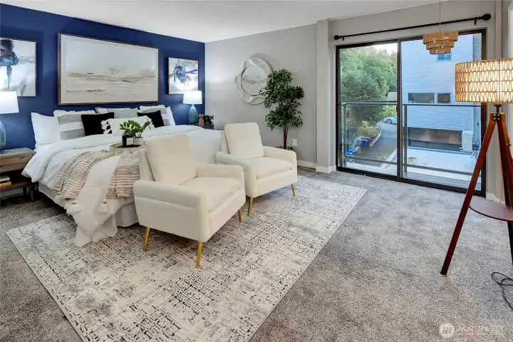 MASSIVE primary bedroom with partial water view from bed.