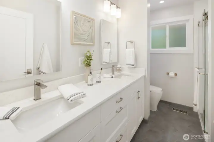 Upstairs Bathroom - Fully updated with medicine cabinet storage behind the pop-out mirrors.  Walk-In Shower.