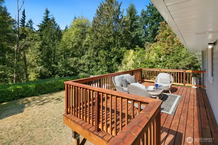 Newly rebuit deck overlooks the back yard.