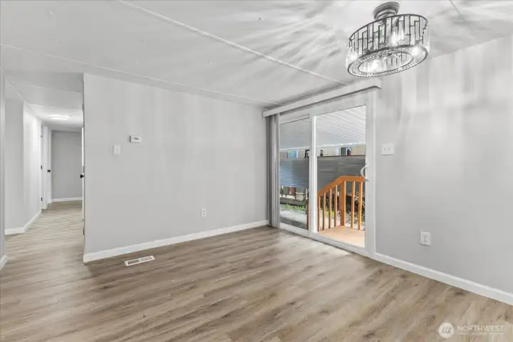 Glass sliding leads to carport and backyard