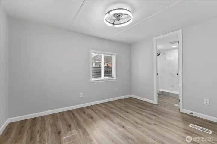 Primary Bedroom with En Suite Bathroom and Walk-in Closet
