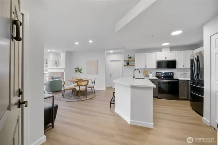 Fresh flooring throughout, updated quartz counters and fresh fixtures.