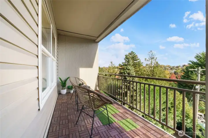 Enjoy morning coffee or dining al fresco on this private balcony.