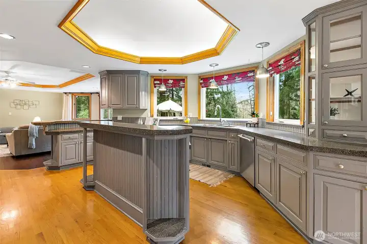 Kitchen with island and glass cabinets.