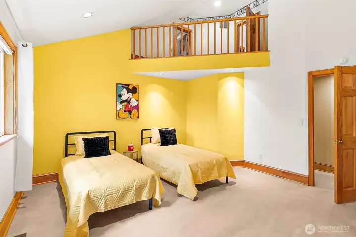 Secondary bedroom with loft balcony.
