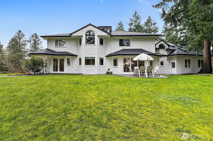 Backyard with green space.