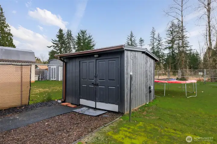 Storage Shed wired with power - stays with sale