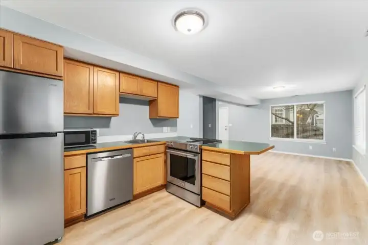 Kitchen looking towards living room and front door.